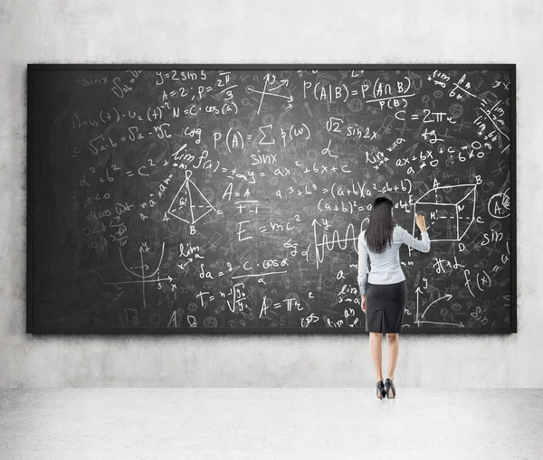 Writing formulas on the blackboard — ストック写真