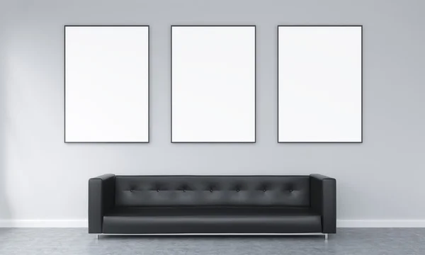 Three frames over a sofa — 图库照片