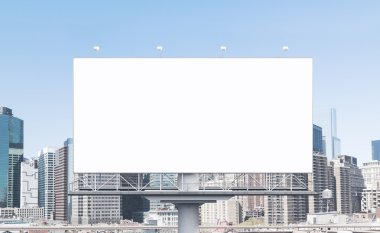 huge blank billboard in the city centre at daytime.