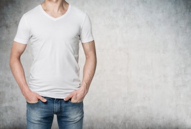 Man with hands in jeans pockets