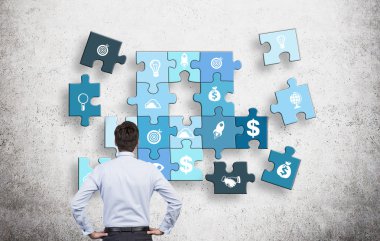 Man collecting a puzzle