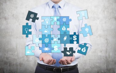 Man collecting a puzzle