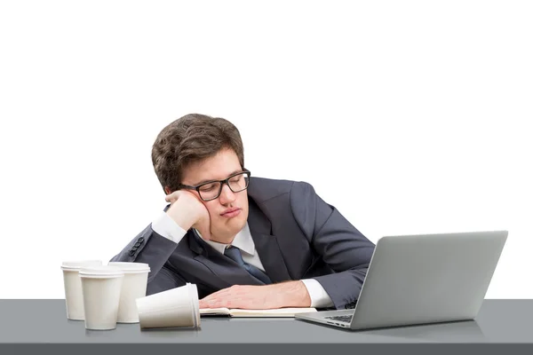 Young man sleeping at working place — Stockfoto