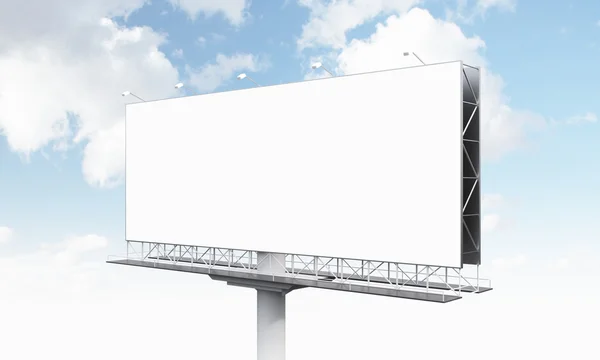 A huge blank billboard on one support, blue sky at the background. — Stockfoto