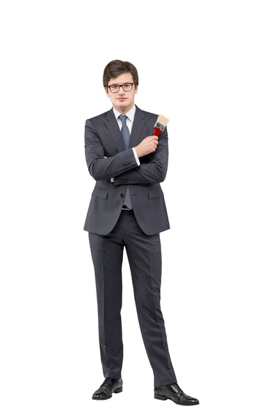 Young businessman with a brush — Stock Photo, Image