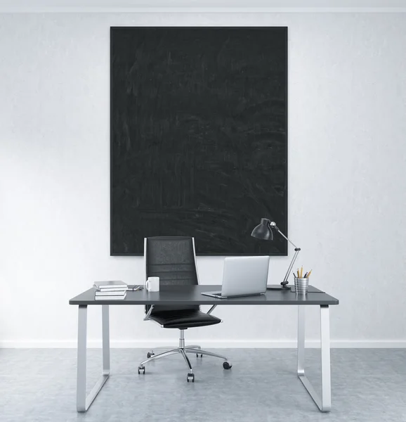 Lugar de trabajo con marco en blanco en la pared — Foto de Stock