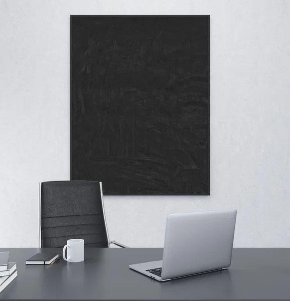 Working place with blank frame on the wall — Stock Photo, Image
