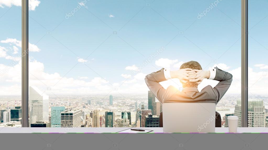 A businessman relaxing in his office