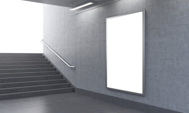 One vertical billboard in the underground, stairs up to the left, light seen.