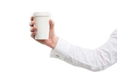 A hand in a white shirt holding a paper cup. White background.