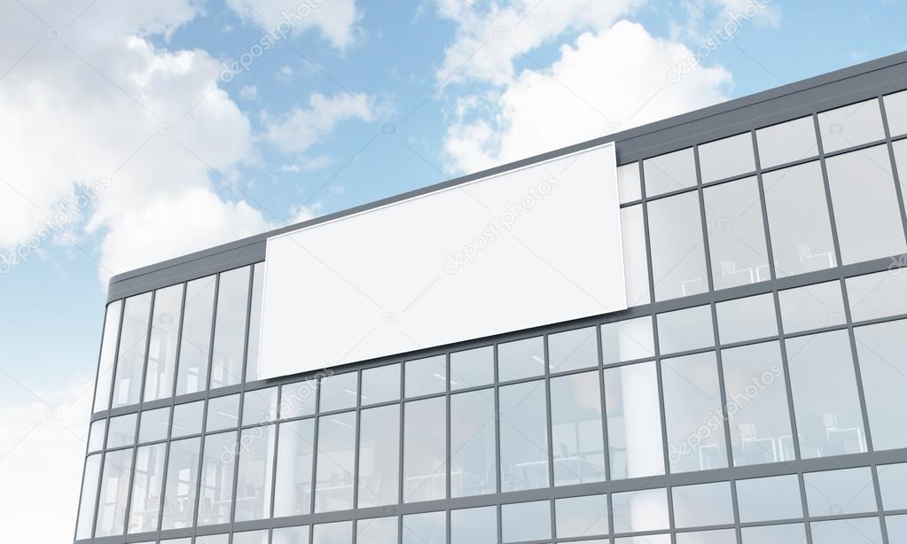 A billboard on the facade of a glass and metal office building. White background. Concept of outdoors advertising. 3D rendering