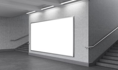 A big blank horizontal billboard in the underground, stairs up on both sides.