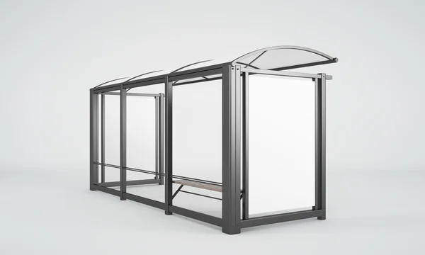 Een bushalte glas en metaal met een kleine bank en de ruimte voor reclame. — Stockfoto