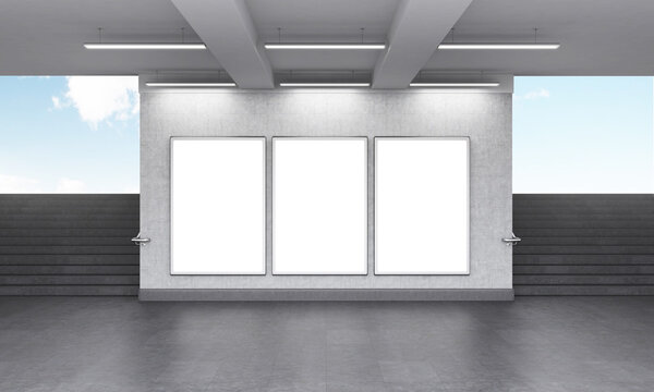 Three blank vertical billboard in the underground crossing, stairs up on both sides, blue sky seen from the street.