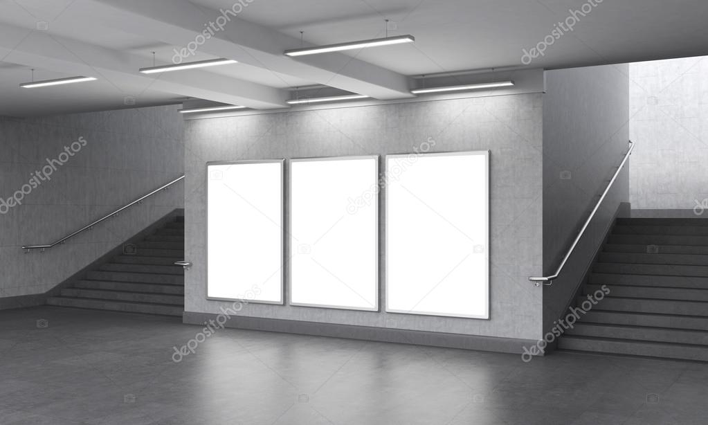 Three blank vertical billboard in the underground, stairs up on both sides.
