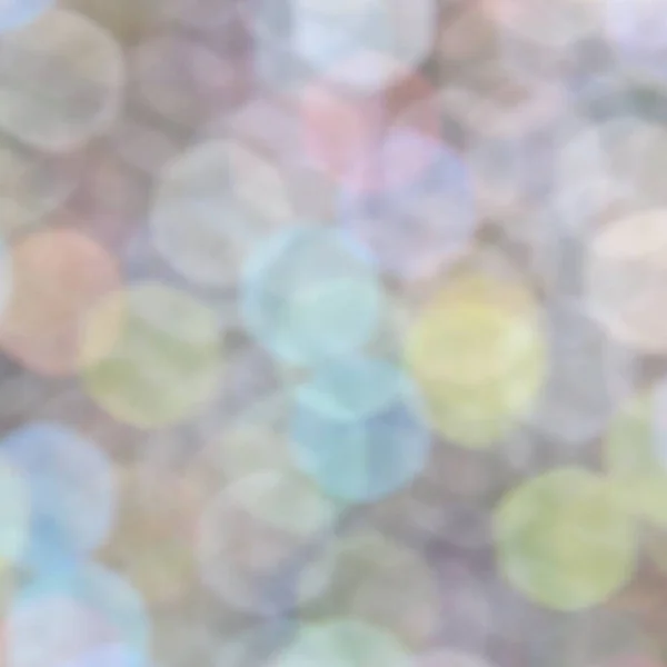Abstraktes Licht Bokeh verschwommenen Hintergrund. Defokussierte Lichter - blau, gelb, grün, orange. — Stockfoto
