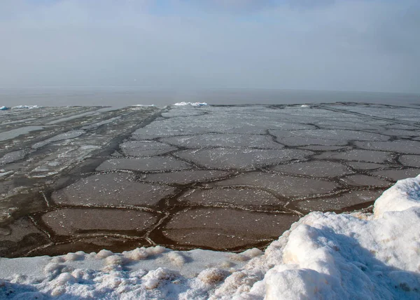 various ice formations in the sea, ice texture on the water surface, beautiful winter day by the sea, winter