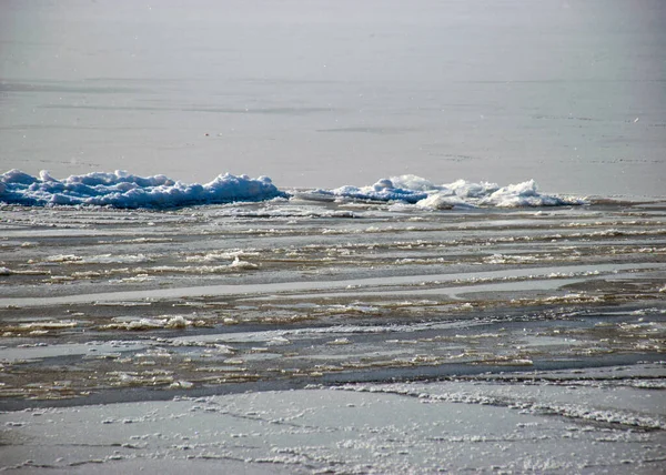 various ice formations in the sea, ice texture on the water surface, beautiful winter day by the sea, winter