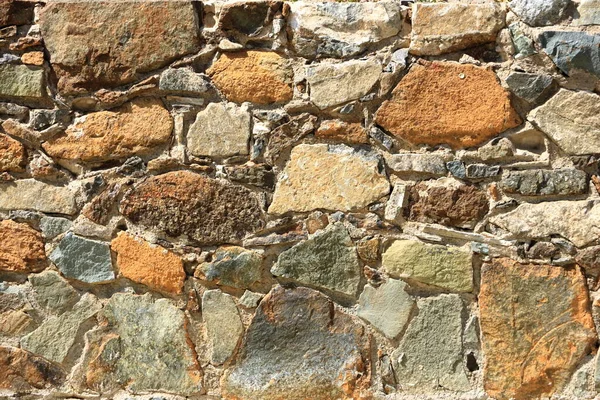 Background of a decorate orange green stone wall surface