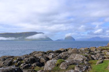 view to Hestur and Koltur Island from Kirkjubour at Streymoy Island, Faroe Islands in Denmark