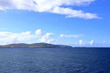 distant view to the north coast of the Shetland Islands (Unst island, Muckle Flugga Lighthouse), Scotland