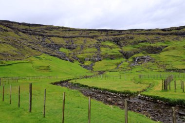 Tjornuvik, Streymoy, Faroe Islands, Denmark, a village surrounded by dramatic mountains and ocean