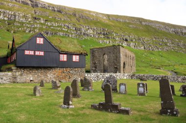 the village of Kirkjubour, famous for the ruins of an ancient cathedral, Kirkjubomururin, on the island of Streymoy, Europe, Faroe Islands in Denmark