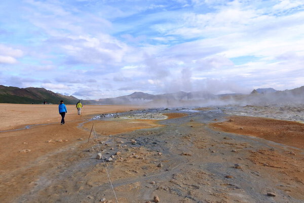 Hverir in Iceland - August 29 2025: people enjoy the geothermal area with boiling mudpools and steaming fumaroles, also known as Hverarond