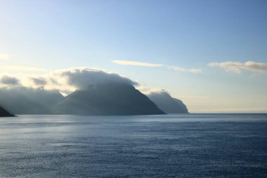 the sea passage between Eysturoy, Bordoy and Kalsoy at Faroe Islands seen from the sea, Denmark