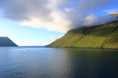the sea passage between Eysturoy, Bordoy and Kalsoy at Faroe Islands seen from the sea, Denmark