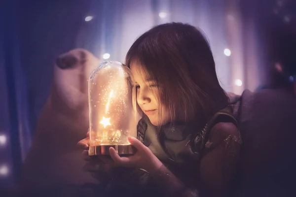 magic photo. a girl watches as a star falls under a glass cloche. Make a wish
