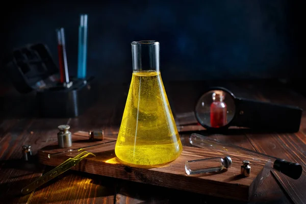 clear yellow liquid in a chemical flask. Science, chemistry
