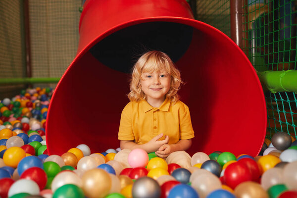 Boy playing in amusement park