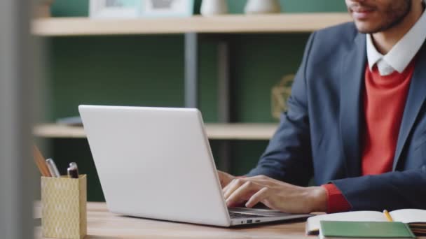 Tracking Midsection Shot Businessman Typing Laptop Taking Notes While Working — Stock Video