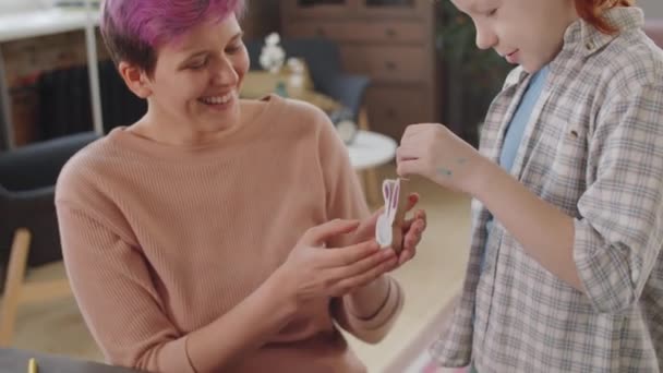 Joyous Mother Looking Handmade Easter Bunny Toy Made Her Son — Stock Video