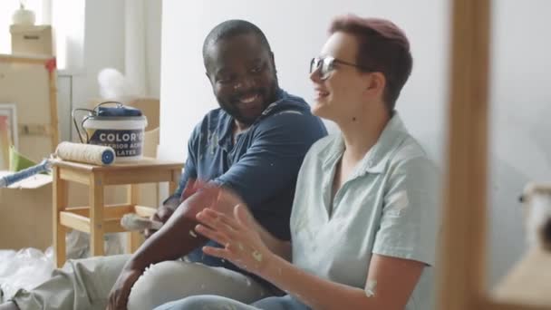 Portrait Cheerful Multiethnic Family Couple Sitting Floor Room Chatting Posing — Stock Video