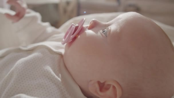 Close Arc Shot Adorable Baby Girl Pacifier Her Mouth Lying — Stock Video