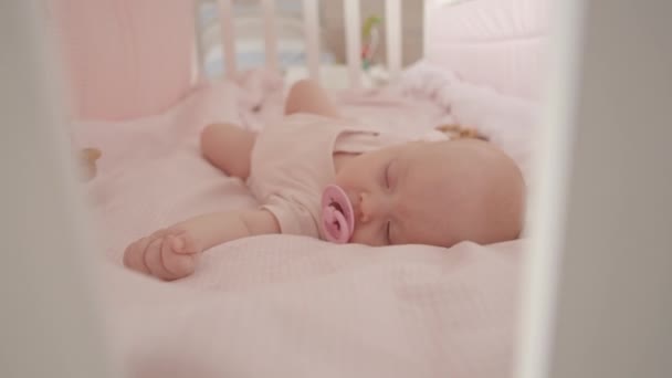 Cute Newborn Baby Girl Sleepsuit Pacifier Her Mouth Sleeping Crib — Stock Video