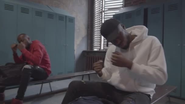 Medium Shot Young Black Boxer Sitting Bench Dressing Room Taking — Stock Video