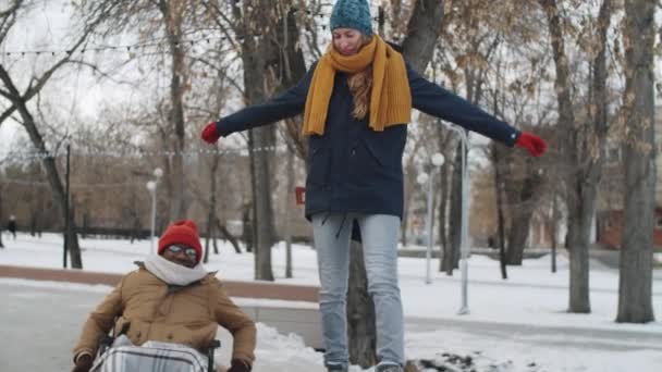 Happy Young Caucasian Woman Walking Chatting Disabled Male Afro American — Stock Video