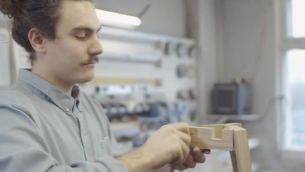 Chest Arc Shot Young Caucasian Man Putting Together Handmade Wooden — Stock Video