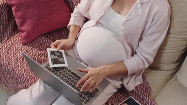 High Angle Shot Pregnant Woman Sitting Sofa Home Holding Fetal — Stock Video