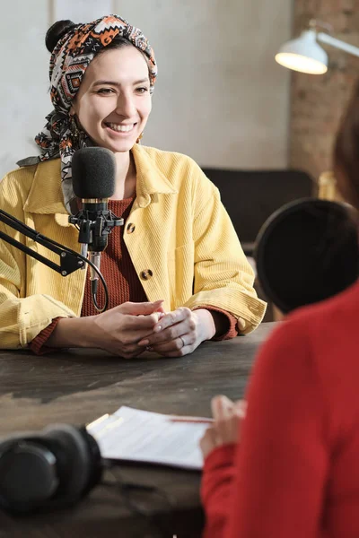 Woman interviewing a woman guest in radio studio