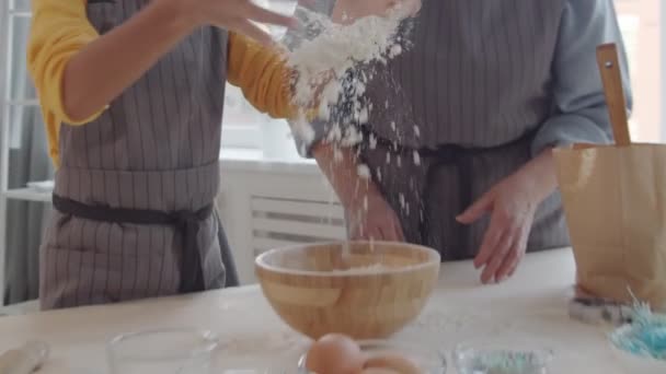 Zoom Playful Little Girl Apron Tossing Flour Clapping Hands Laughing — Stock Video