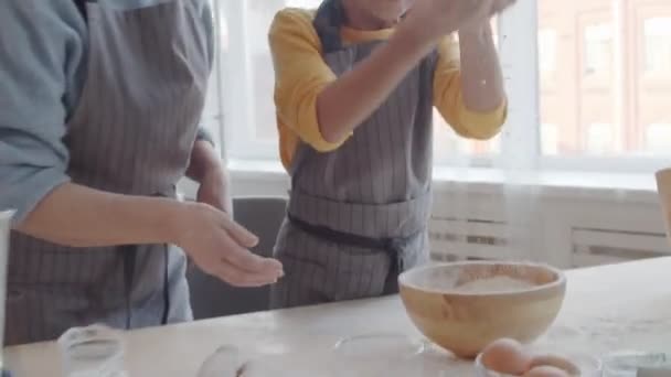 Zoom Shot Joyous Little Girl Apron Throwing Flour Air Clapping — Stock Video