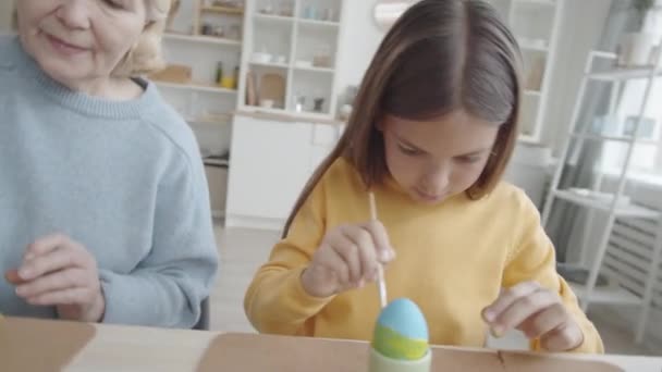 Zoom Out Shot Cute Caucasian Girl Decorating Easter Egg Paintbrush — Stock Video