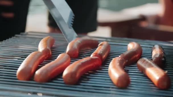 Close Shot Unrecognizable Man Flipping Sausages Grill Metal Tongues While — Stock Video