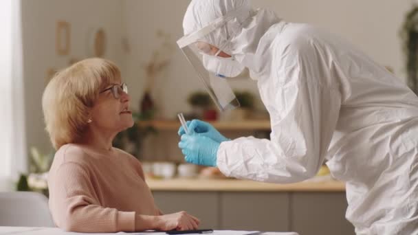 Nurse Protective Suit Face Shield Gloves Taking Nasal Swab Senior — Stock Video
