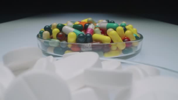 Zoom Out Shot Three Glass Dishes Filled Colorful Pills White — Stock Video