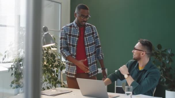 Young Black Man Walking Caucasian Colleague Greeting Him Handshake Discussing — Αρχείο Βίντεο